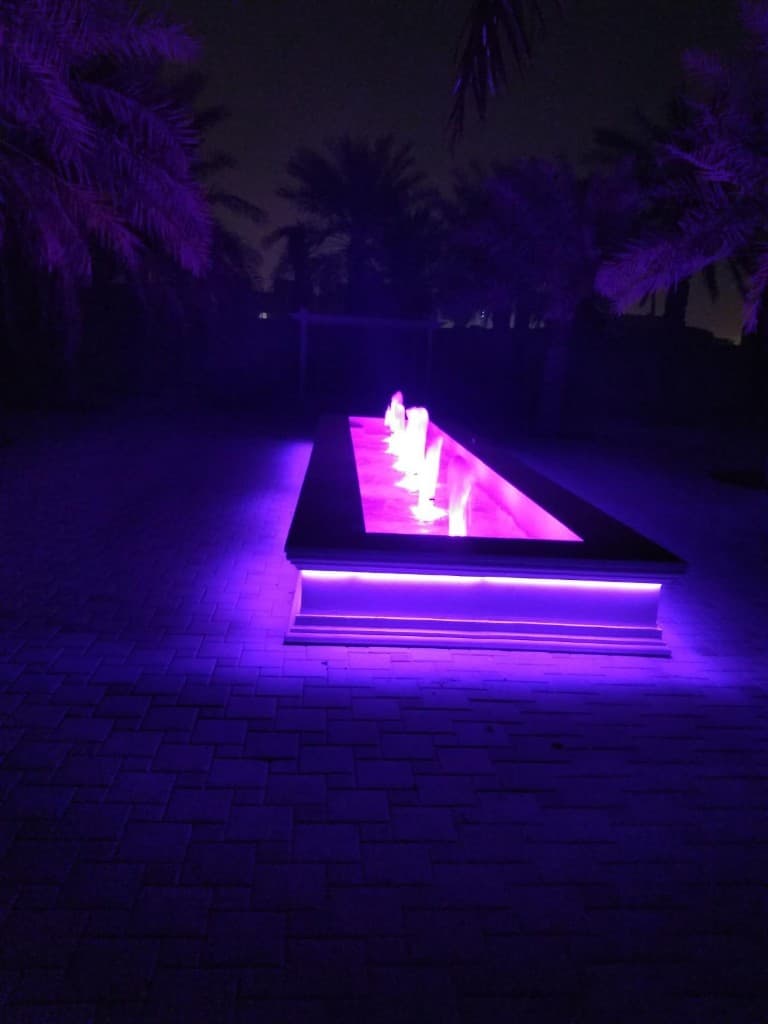 Master craftsmen commissioning a luxury water feature on site in Qatar
